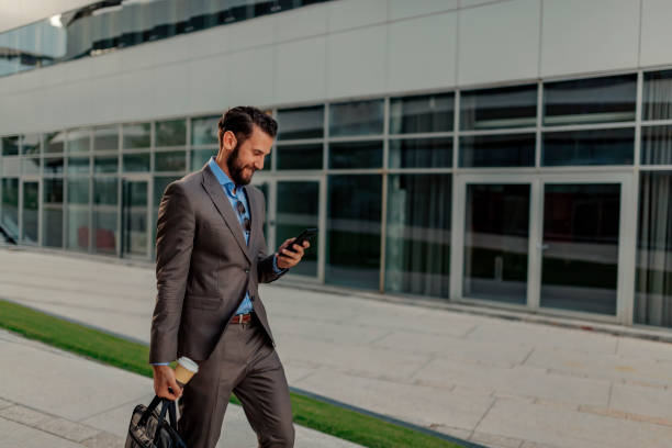 istock Businessman Using Smartphone Outdoor 1162552998