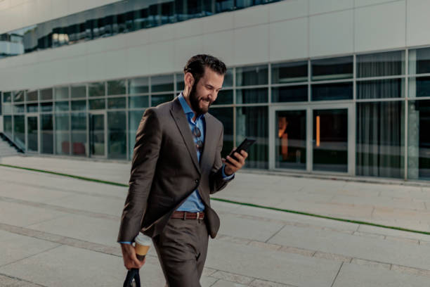 istock Businessman Using Smartphone Outdoor 1162553029