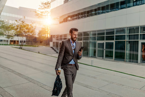 istock Businessman Using Smartphone Outdoor 1162553100