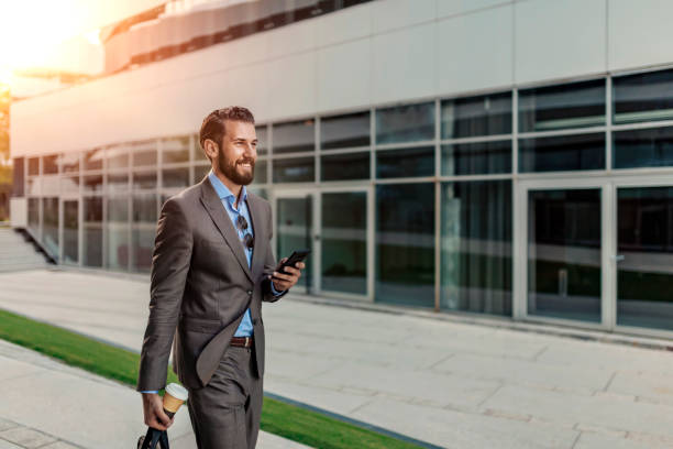 istock Businessman Using Smartphone Outdoor 1162553103