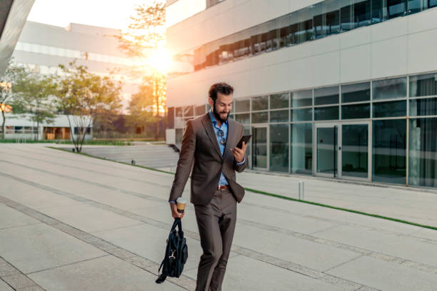 istock Businessman Using Smartphone Outdoor 1162553228