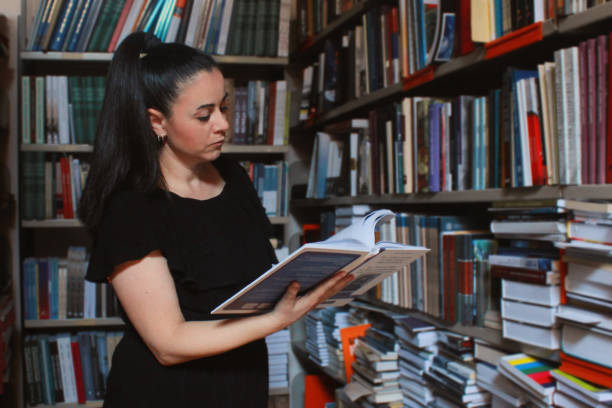 istock Woman Librarian among books 1162554755