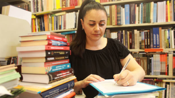 istock Woman Librarian among books 1162554764