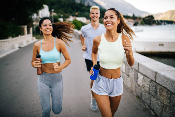 istock Group of young people jogging and running outdoors in nature 1162556513