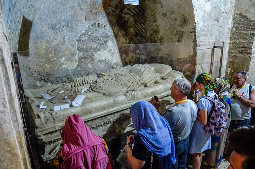 Demre, Turkey - May 22, 2019: Pilgrims near the sarcophagus of St. Nicholas in Demre, Turkey