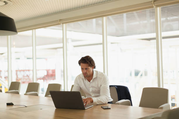 istock Businessman using mobile phone in the conference room 1162557983