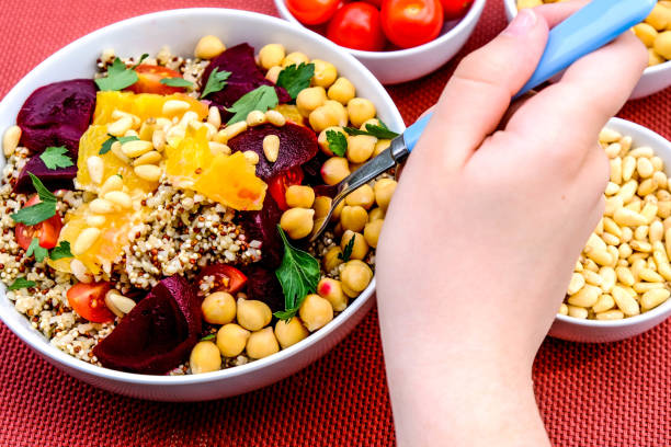 istock Healthy Vegetarian Lunch Bowl With Chickpeas, Beetroot, Tomato, Orange and Quinoa 1162558447