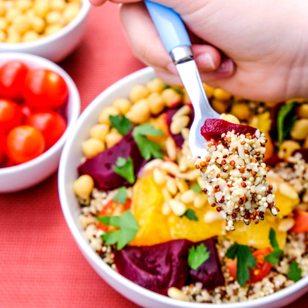 istock Healthy Vegetarian Lunch Bowl With Chickpeas, Beetroot, Tomato, Orange and Quinoa 1162558455