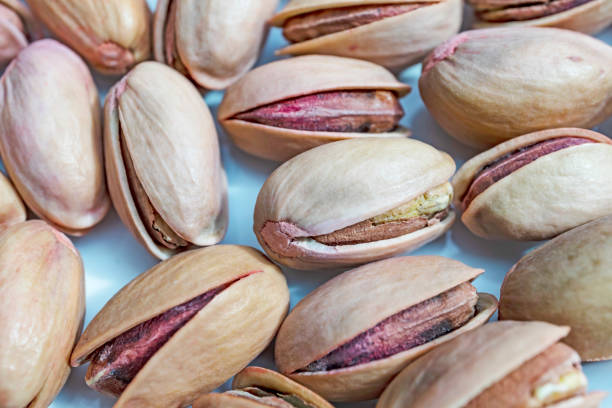 istock close up shelled pistachios in white plate 1162559452