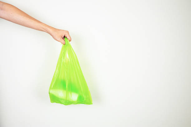 istock Plastic bottles inside plastic bag with one hand holding. 1162561366