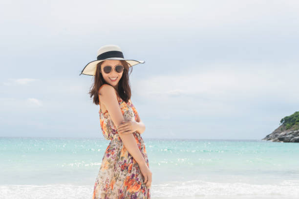istock Woman having fun at beach 1162561892