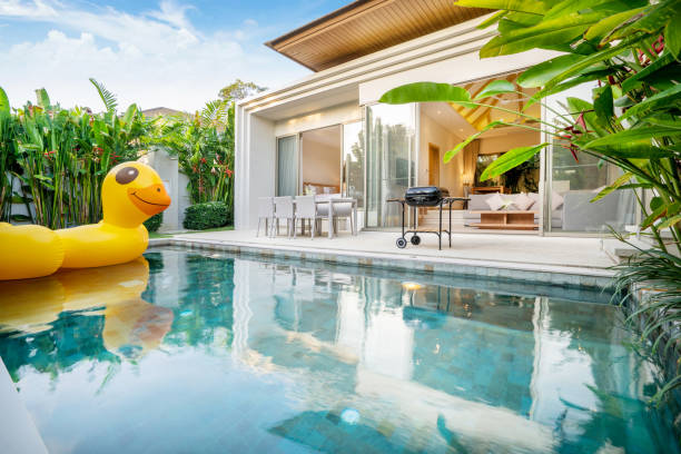 istock home exterior design with showing tropical pool villa with greenery garden 1162562506