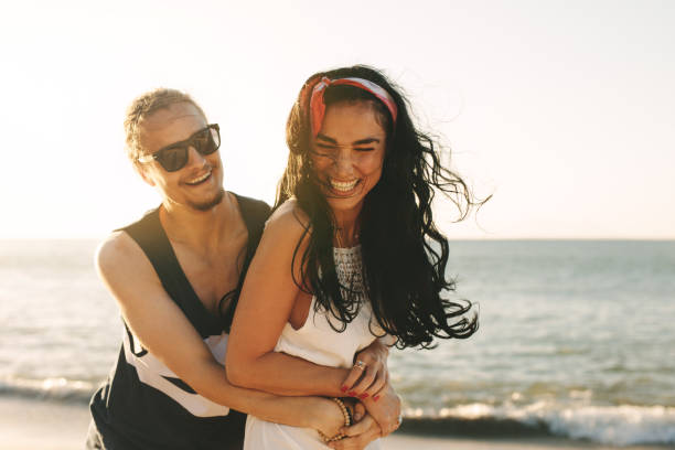 istock Affectionate couple enjoying on beach vacation 1162562598