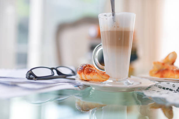 Coffee latte made with coffee and steamed milk on the table.