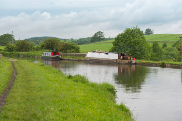 istock Narrowboat on a British canal in rural setting 1162564548