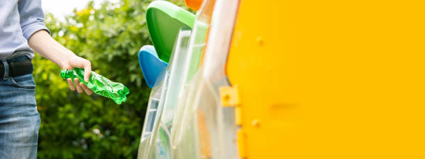 istock Banner ratio, putting plastic bottle into recycle bin. 1162564593