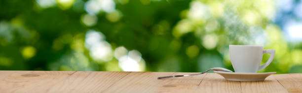 istock image of cup with tea on wooden board closeup 1162564700