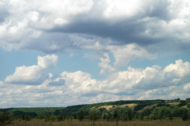 istock A cloudy day in a green summer hilly valley. 1162567215
