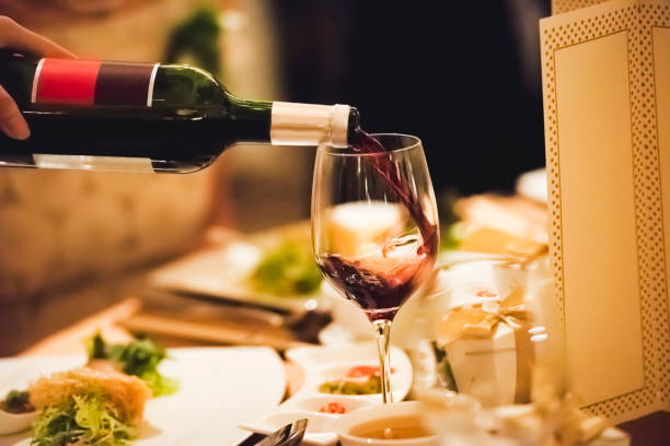 istock Waiter pouring wine inside the glass 1162567253