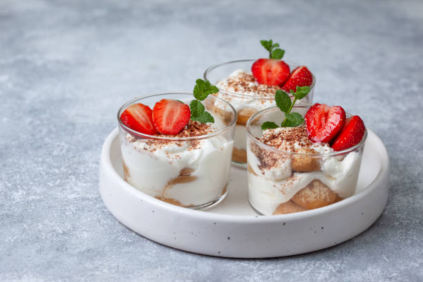 istock tiramisu in a glass with fresh strawberries 1162569100