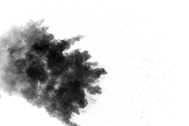istock Black powder explosion on white background. Abstract black dust particles splash on white background. 1162569185