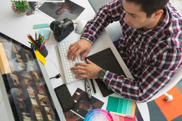 istock Male graphic designer working on computer at desk 1162569330