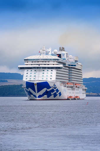 South Queensferry, Scotland - August 14, 2018:  Princess cruise ship, the Royal Princess, anchored in the Firth of Forth to transport passengers to the shore of South Queensferry.