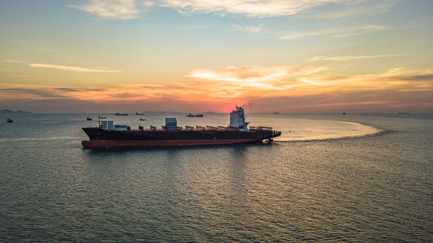 istock Container ship at sunset, Logistics and transportation of international container ship in the sea. 1162571708