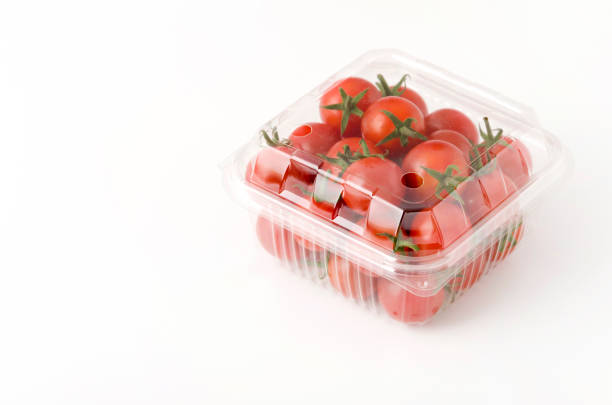 Cherry tomatoes in a plastic container. 
Fresh cherry tomatoes in box on white background. Cherry tomatoes in a plastic container. 
Fresh cherry tomatoes in box on white background. grape tomato stock pictures, royalty-free photos & images