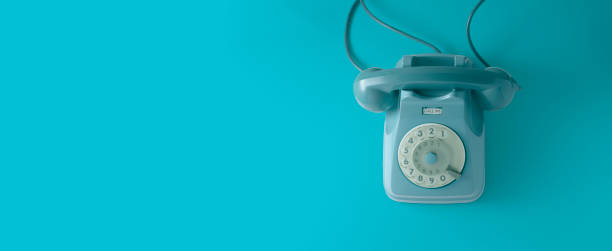 istock A vintage dial telephone with blue background. 1162574229