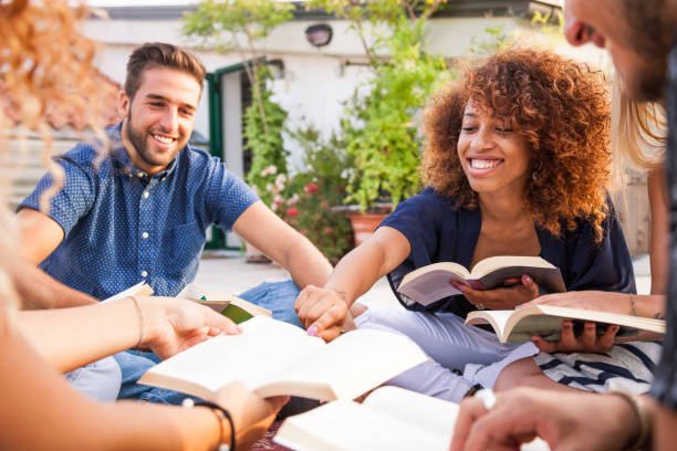 istock Group and public reading with friends 1162574666