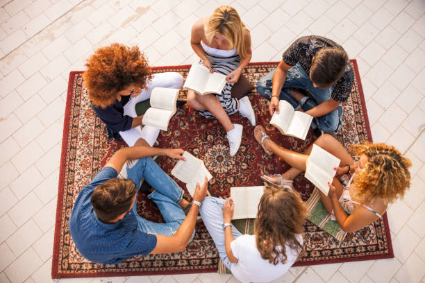 istock Group and public reading with friends 1162574695