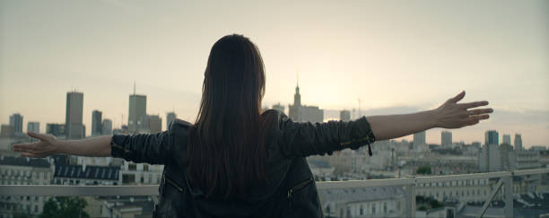 istock Young woman on a rooftop. Enjoying freedom 1162576304