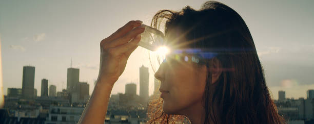 istock Crystal healing. Woman on a rooftop with city panorama 1162576368