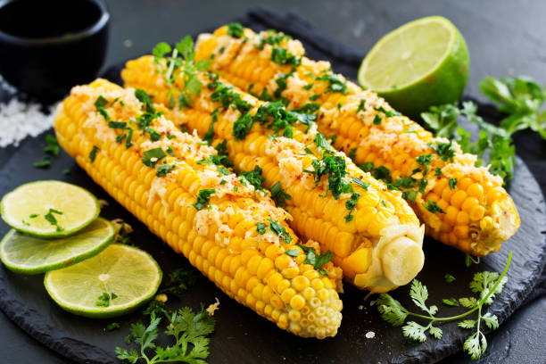 istock Boiled corn with mexican spices, butter, cilantro. 1162576536