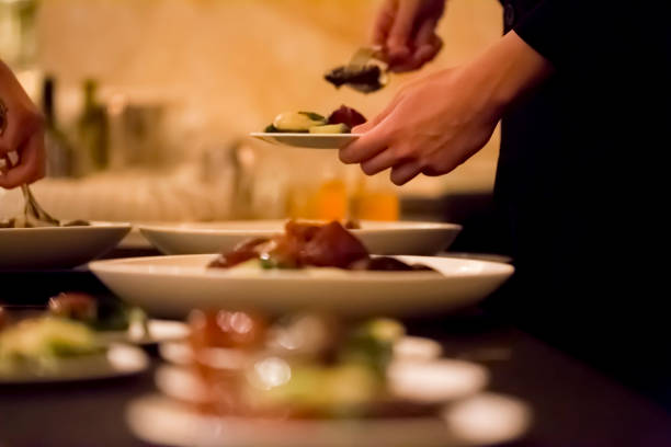 istock Waiter serving food with plates 1162577872