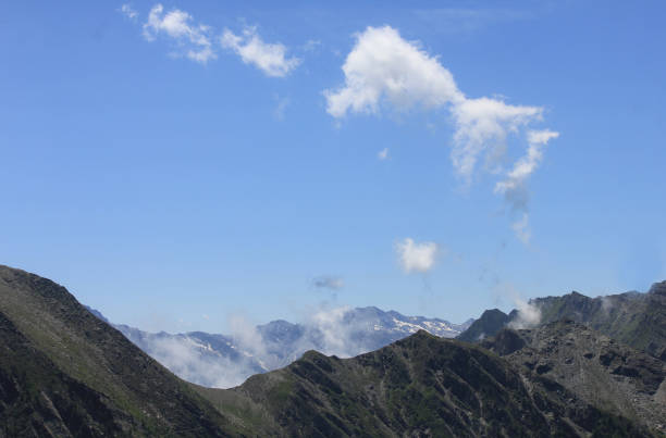 istock mountain range in Italy in Summer with clouds and rocks 1162578925