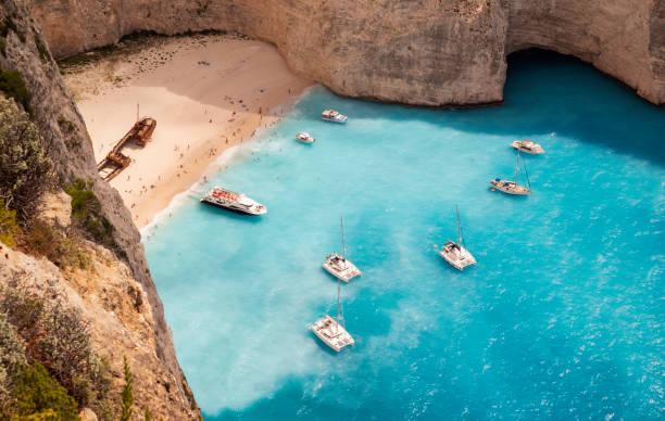 Shipwreck Beach Of Zakynthos Navagio Beach, or Shipwreck Beach, on the coast of Zakynthos, Greece. zakynthos stock pictures, royalty-free photos & images