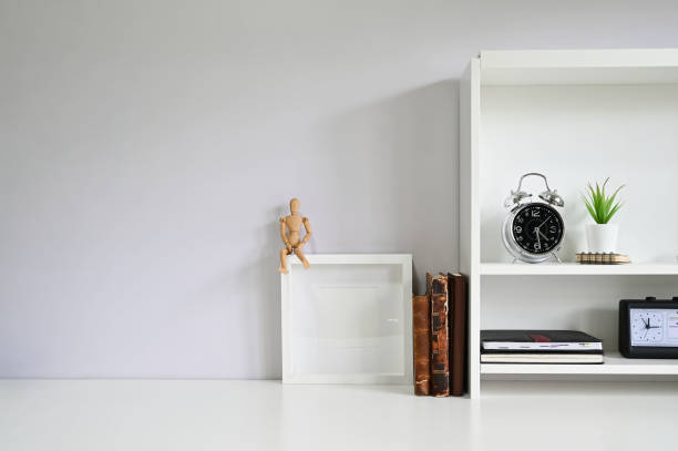 istock Copy space with books, alarm on white table. 1162583010