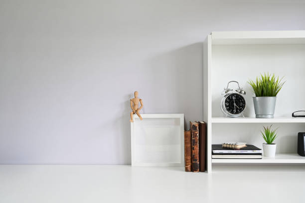 istock Copy space with books, alarm on white table. 1162583022