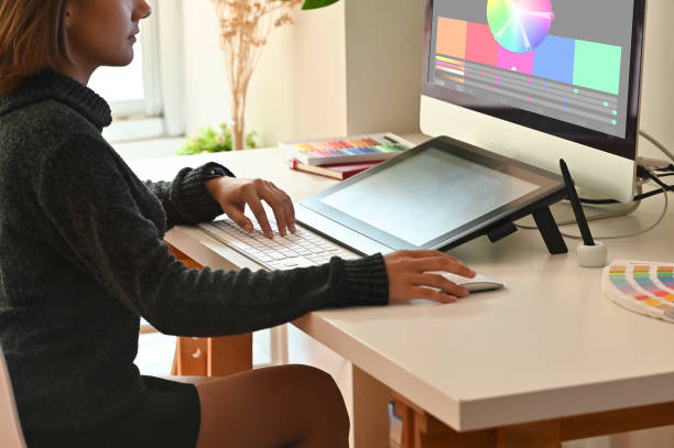 istock Graphic designer working with digital tablet and pen on creative workspace. 1162583138