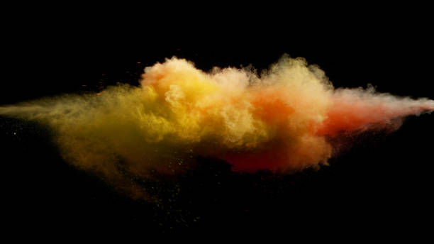 istock Collision of colored powder isolated on black 1162585740