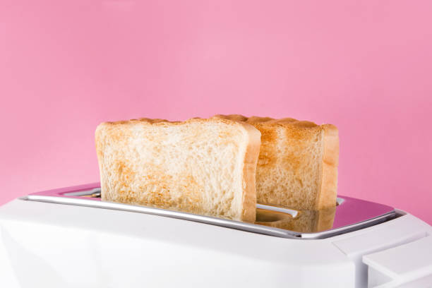 istock Toasted toast bread in white toaster 1162586104