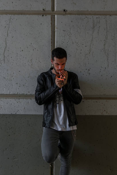 istock Young man smoking in a tunnel 1162589063
