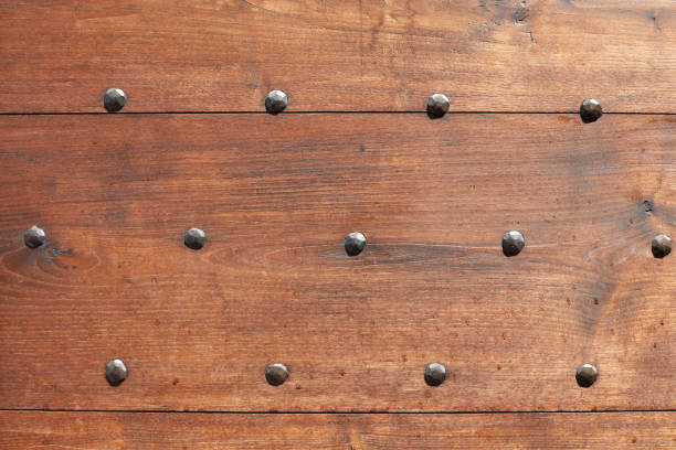 Wooden door with nails texture background
