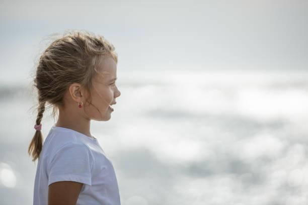 Cute little looking at the sea. This file is cleaned and retouched.