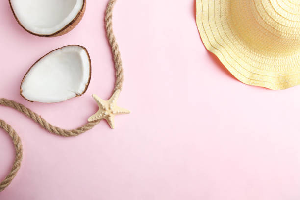 istock coconut, starfish and beach straw hat 1162592660