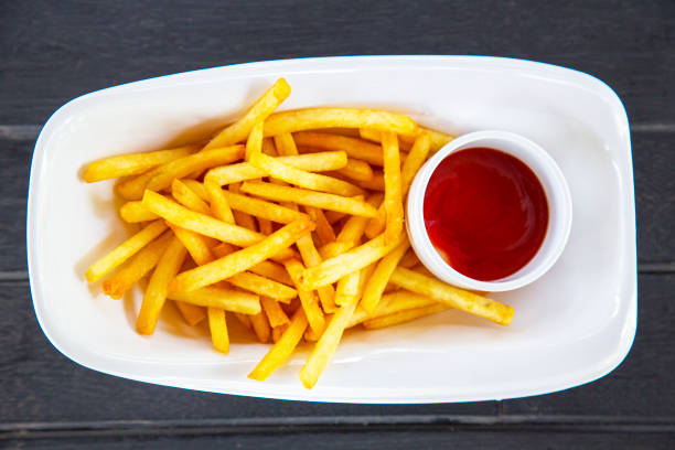 istock French fries with ketchup on wood table 1162592717
