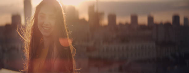 istock Girl on a rooftop. Flirting with camera 1162594339