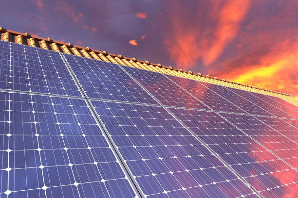 istock Solar panels modules on house roof with sunset sky in background 1162595076
